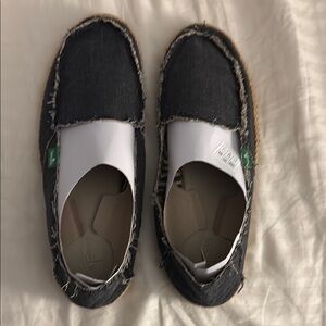 Sanuk Black Canvas Slip-Ons with Natural Trim